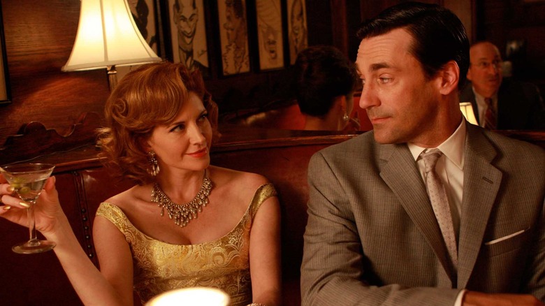 Melinda McGraw and Jon Hamm drinking cocktails