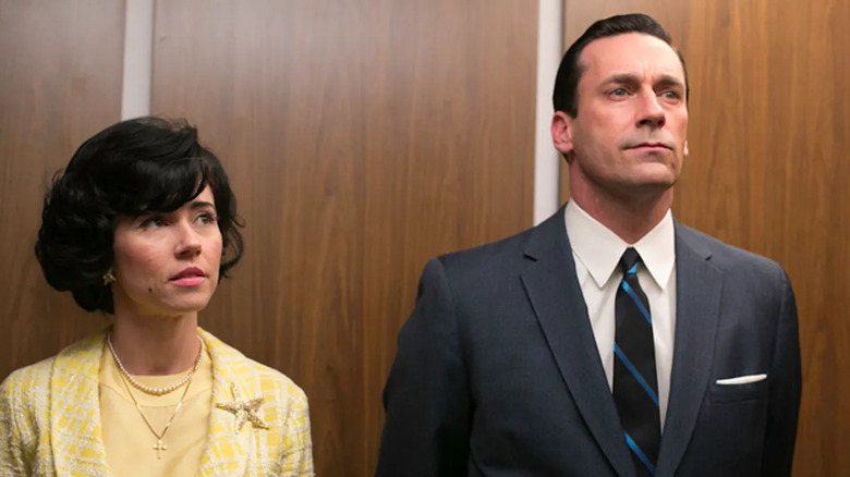 Linda Cardellini and Jon Hamm standing in elevator