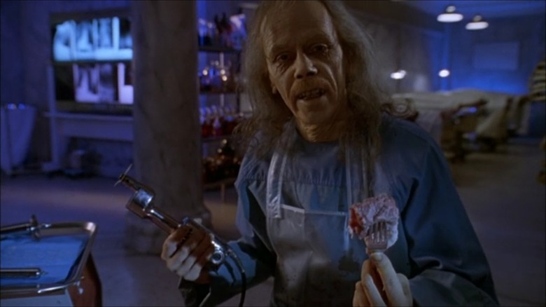 John Carpenter as The Coroner in Body Bags