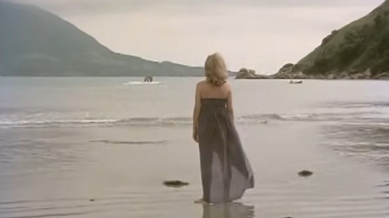 Helena standing on the beach in Excitation