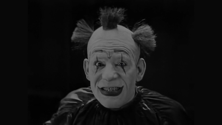 Lon Chaney grinning at the camera in He Who Gets Slapped