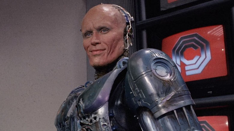 unmasked RoboCop smiling