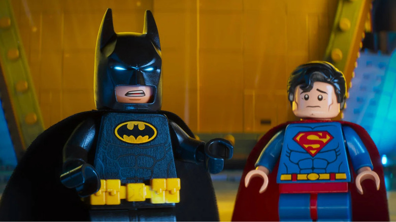 LEGO Batman standing next to LEGO Superman