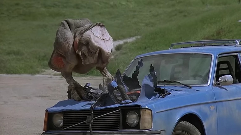 A graboid destroys a car in Tremors 2: Aftershocks